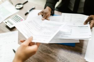 Person applying for car financing at a dealership near Anderson, IN