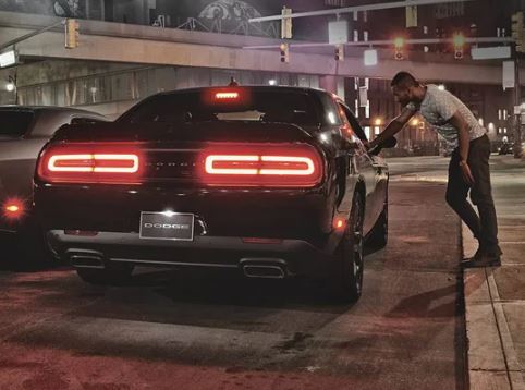 Dodge Challenger parked on a street near 