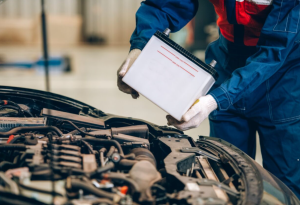 A car battery replacement being performed at a local service center near Anderson, Indiana.