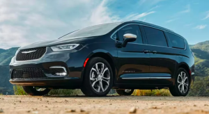 A black 2024 Chrysler Pacifica parked outdoors on a dirt road near Anderson, Indiana