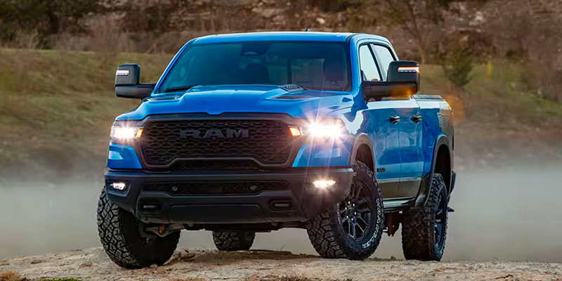 Blue Ram 1500 pickup truck driving off-road