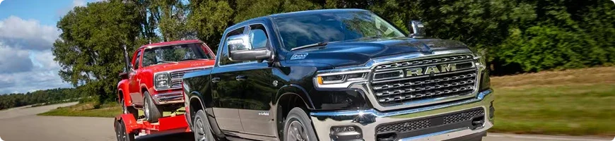 2026 RAM 1500 towing a trailer, with ratings tied to engine, cab, box, drive and axle