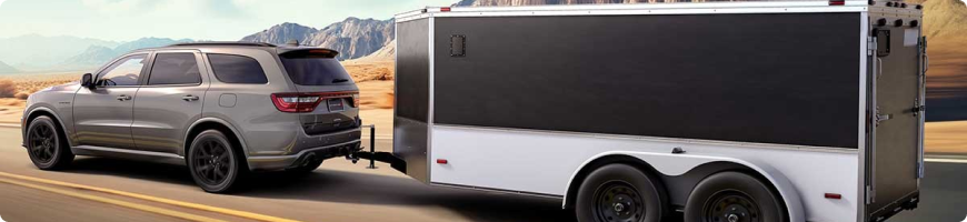 2026 Dodge Durango towing a trailer, rated up to 8,700 lbs with Tow ’n Go